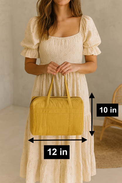 Woman holding a yellow case containing a water hyacinth wicker woven picnic mat neatly folded in the case with measurements indicated