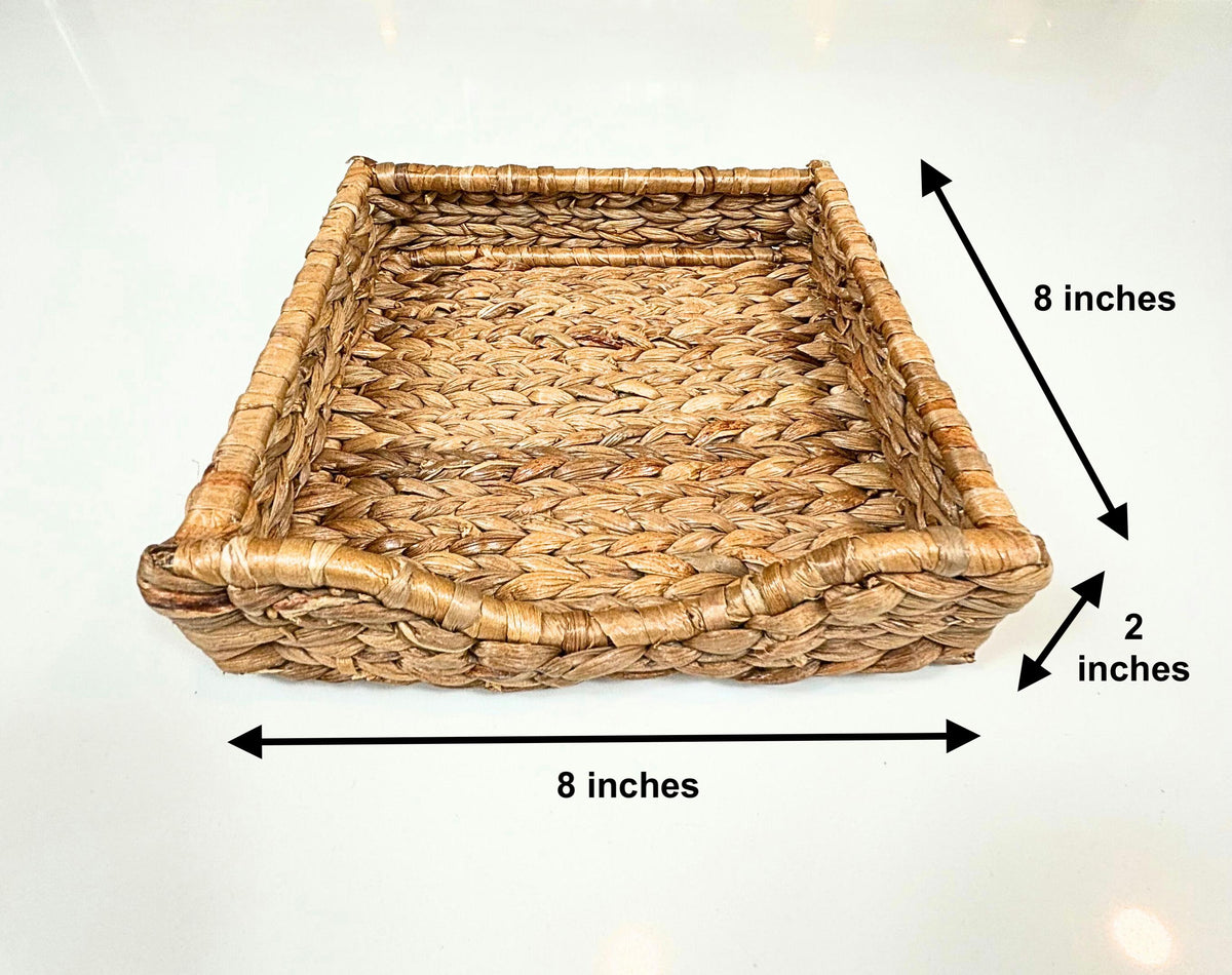 A handwoven natural water hyacinth rectangular napkin holder or seagrass tray placed on a white background, with dimensions labeled indicating 8 inches by 2 inches.