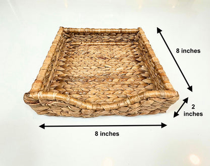 A handwoven natural water hyacinth rectangular napkin holder or seagrass tray placed on a white background, with dimensions labeled indicating 8 inches by 2 inches.